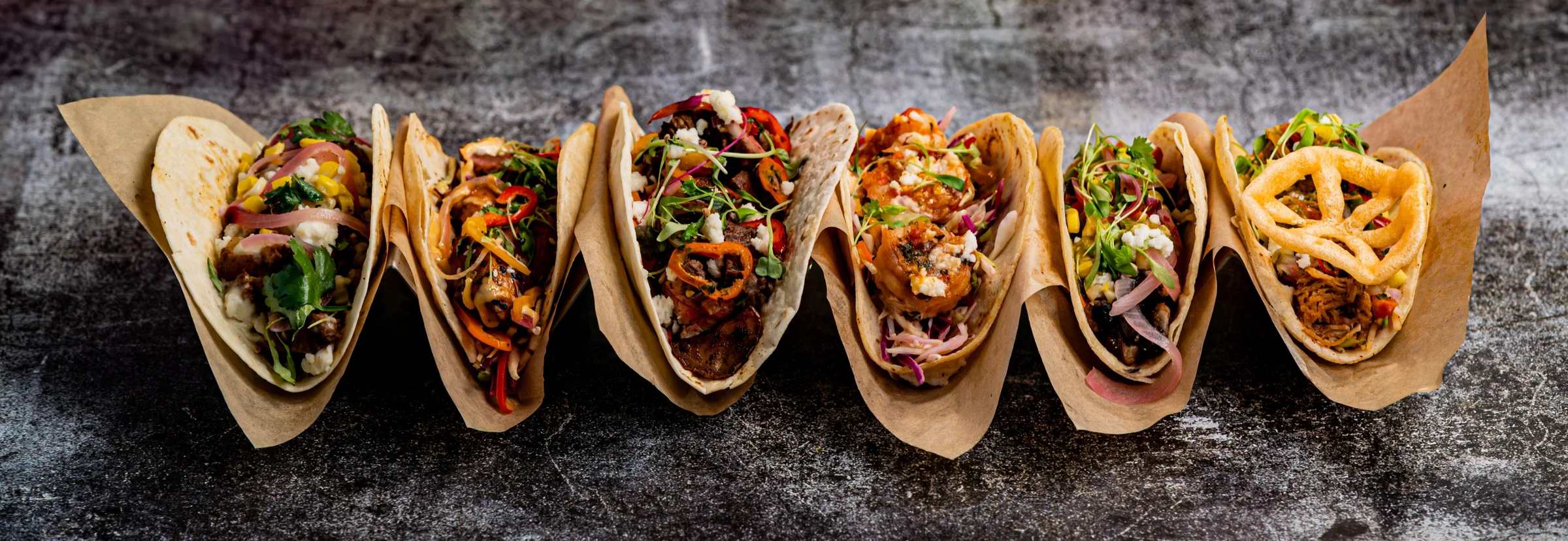 A row of Flora Cantina signature tacos